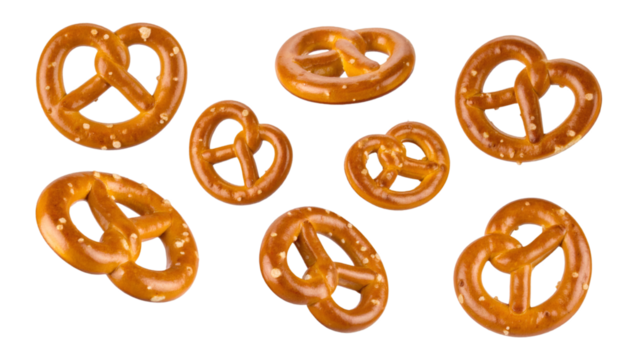 Multiple pretzel pieces levitating on transparent background