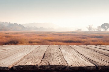 Rustic wooden table in a misty autumn landscape