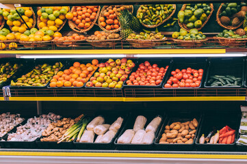 Fresh fruits and vegetables on the supermarket shelf.