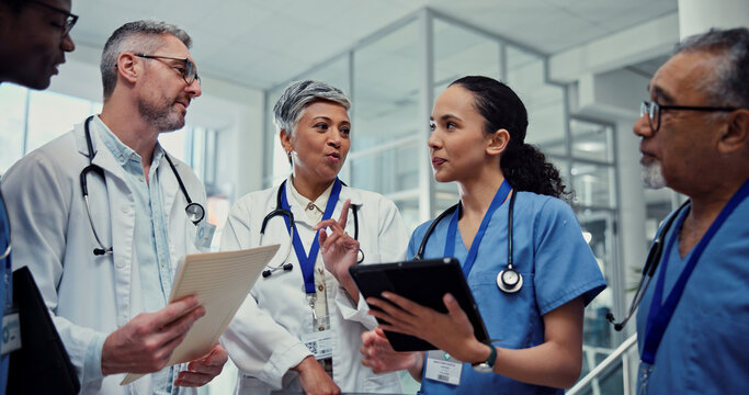 Collaboration, medical or tablet with doctors and nurses in hospital together for conversation or discussion. Agenda, healthcare and talking with professional medicine team in clinic for planning