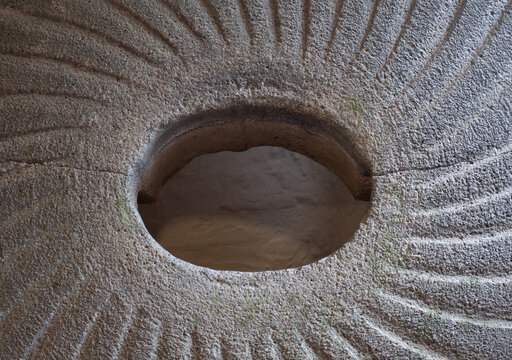 Detail of a millstone in a water wheel at Cotehele Cornwall