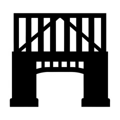 Silhouette of an old bridge with arched opening and truss supports