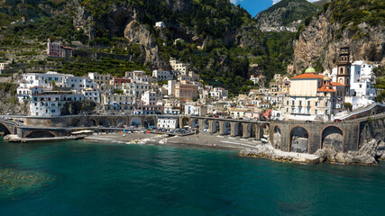 Aerial view of the town of Atrani, in the province of Salerno, in Campania, Italy. It is one of the most beautiful and touristic places on the Amalfi coast, overlooking the Mediterranean Sea.