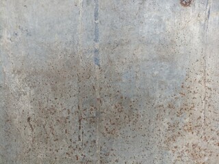 Rusty Concrete Wall Texture Background. Close-up of an old concrete wall with weathered rust...