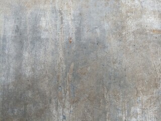Scratched Concrete Wall Texture. Raw concrete wall surface with subtle scratches and stains, perfect for use in industrial, grunge, or urban design backgrounds