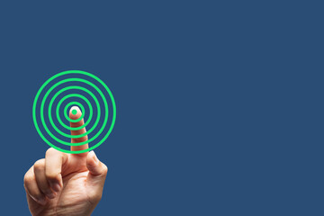 Finger Touching Green Concentric Circles on Blue Background