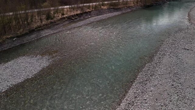Aerial above Linth river shallow water cold mountain stream Switzerland