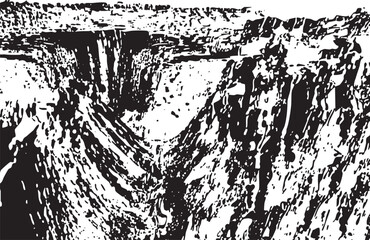Obraz premium Dramatic towering rock formations rise sharply from a deep canyon floor.