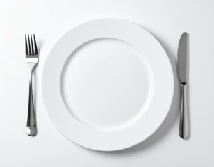Empty White Plate With Fork And Knife On White Table
