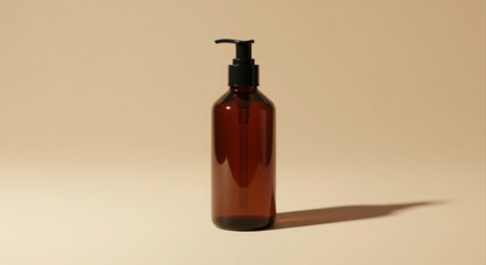 Amber glass pump bottle with black pump in a studio setting. Empty bottle displayed on a minimalist beige background.