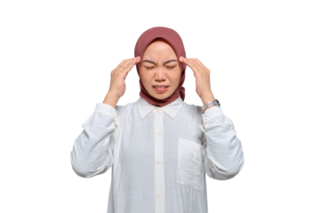 Young Asian Muslim woman pressing finger to temple, having headache, feeling depressed after work isolated on transparent background