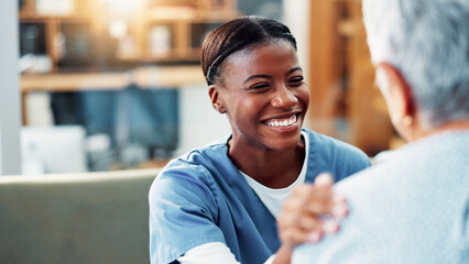 Happy woman, nurse and hand on shoulder for support, healthcare and medical wellness in home....