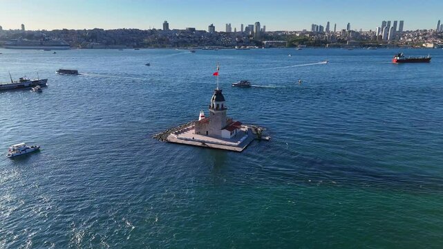 Uskudar high angle 4k video of the Maiden's Tower in Istanbul's Bosphorus. An aerial shot of the Leander's Tower (Kiz Kulesi) in Istanbul, Turkiye, nestled in the calm waters of the Bosphorus Strait.