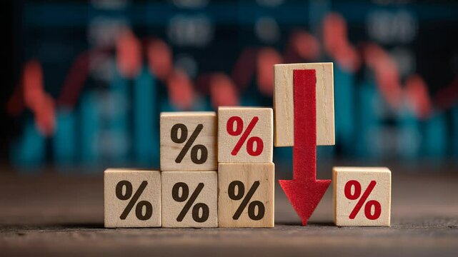 Downward trend symbol on wooden blocks with percentage signs and a red arrow illustrating financial decline and market fluctuation concepts
