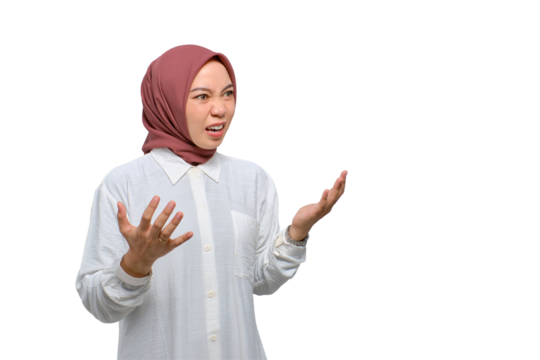 Angry young Asian Muslim woman raising hands and shouting with rage isolated on transparent background
