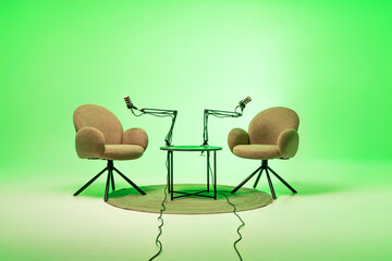 Setting up for an engaging podcast interview with two cozy chairs and microphones in a vibrant...