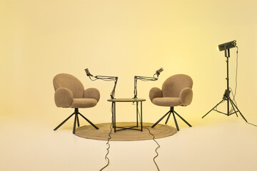 Podcast setup with two chairs and microphones for an educational interview session