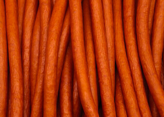 Close-up of many sausages at the market. Background with sausages