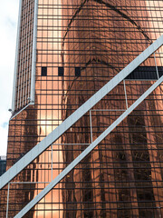 Modern building with glass facade reflecting
