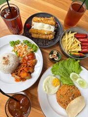 Indulgent Feast: This vibrant and visually appealing image showcases a diverse and delicious spread of food, inviting viewers to experience a culinary adventure.