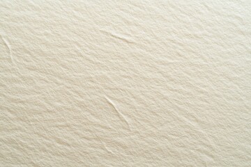 Cream paper texture, close-up view, smooth surface, background showing creased paper