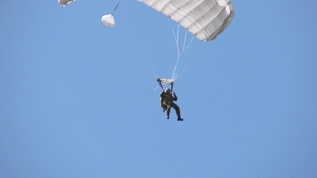 Military paratrooper in the air, close-up