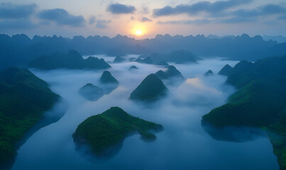 Misty Sunrise Over Green Mountains and Serene Lake