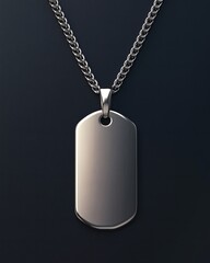 Fototapeta premium Silver dog tag pendant on a delicate chain against a dark background, showcasing a classic and versatile piece of jewelry with a minimalist and sophisticated design