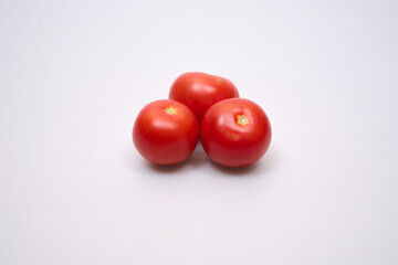 red tomatoes on a white background