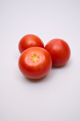 red tomatoes on a white background