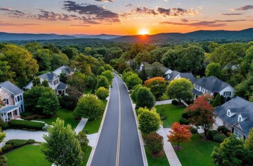 Obraz premium Aerial view of a residential neighborhood in the late afternoon, during the golden hour before sunset.
