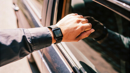 Close up of a man hand holding a car keys. Ready to Drive: Close-Up of a Man Holding Car Keys

