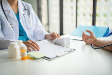 A doctor is measuring blood pressure.