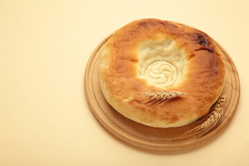 Georgian traditional bread flatbread on beige background.