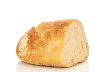 One half of a loaf of bread isolated on a white background, close-up.