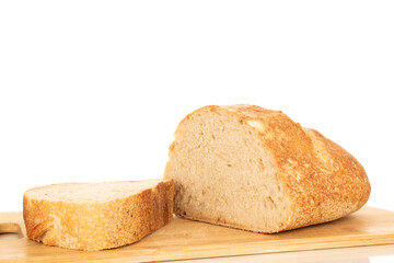 One half of a hearth bread on a bamboo board isolated on a white background, close-up.