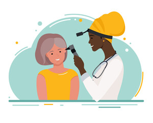 A female ENT doctor examines the patient's ear.