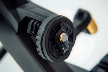 Close up view of modern black and gold exercise bike handle and controls