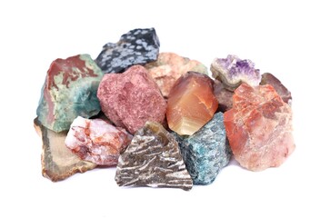Group of various raw semi precious stones on white background.