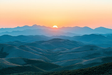 Obraz premium Sunset Over Blue and Orange Mountain Range