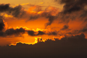 Sky with Colorful Pink Golden and Dark Clouds at Sunset. Abstract Texture Background Pattern.