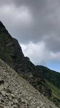 Panoramic video crossing Kozi Wierch towards Czarny Staw pod Rysami in the Tatra Mountains, Poland, on a cloudy day.