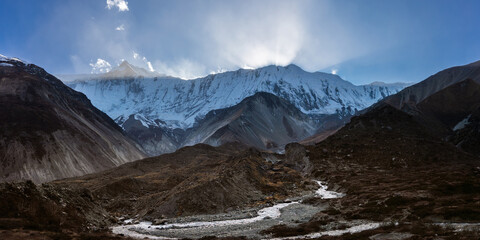 Fototapeta premium The sun is setting behind the Himalaya mountain. Mountain landscape near Tilicho base camp, Nepal.