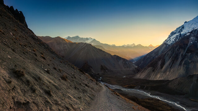A look back to Manaslu and Pisang mountains from the route to Tilicho lake at sunrise. Early morning in Himalaya mountains, Nepal.