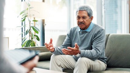Senior man, counseling and sofa with therapist for discussion, mental health or therapy session....