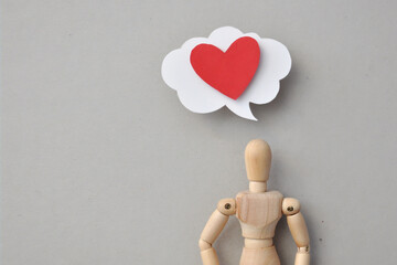 Red paper heart on a balloon with a speech. A symbol of love, messages of love and declarations of love
