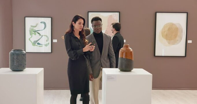 Art, phone and photography with people in gallery for museum sculpture, exhibition or artwork collection. Gala expo, social media and online auction catalog with woman and mobile for picture on event