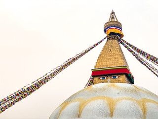 Boudhanath Boudha Stupa in Kathmandu, Nepal with many waving prayer flags
