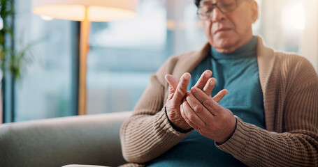 Hands, home and old man with pain, muscle tension or inflammation with arthritis in living room....