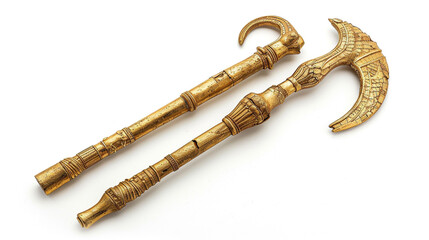 A ceremonial crook and flail set in gold, the dual symbols of pharaonic kingship and rule, displayed on white.